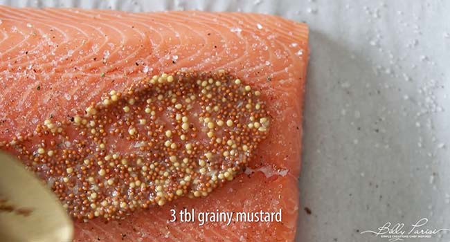 adding mustard to salmon