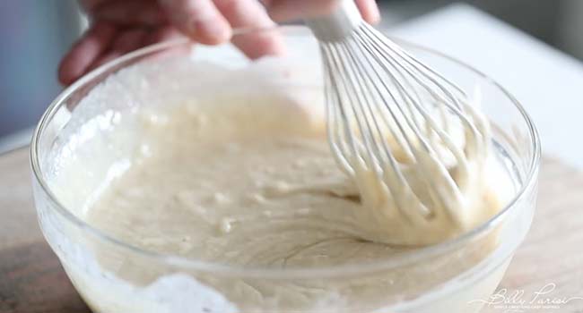 mixing a peach cobbler batter