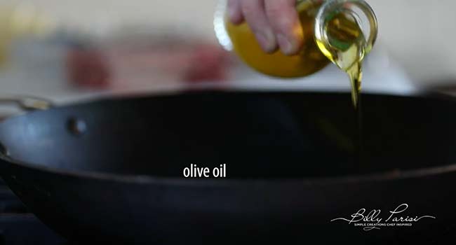 adding oil to a pan