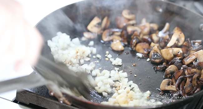 cooking garlic and onions with mushrooms