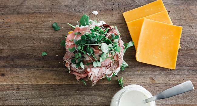 micro greens on a roast beef sandwich