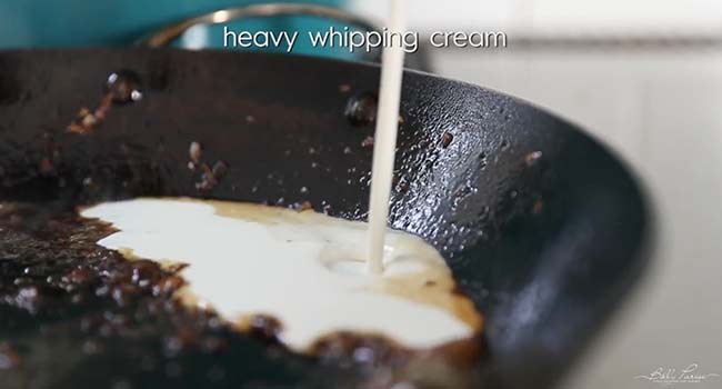 adding cream to a pan