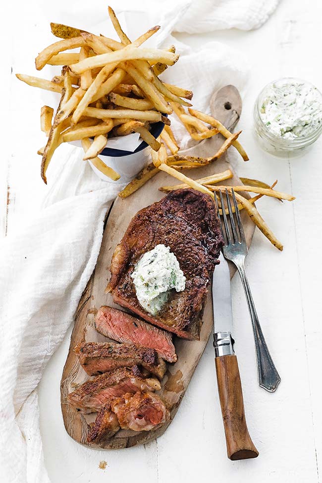 frites or french fries with steak and herb butter