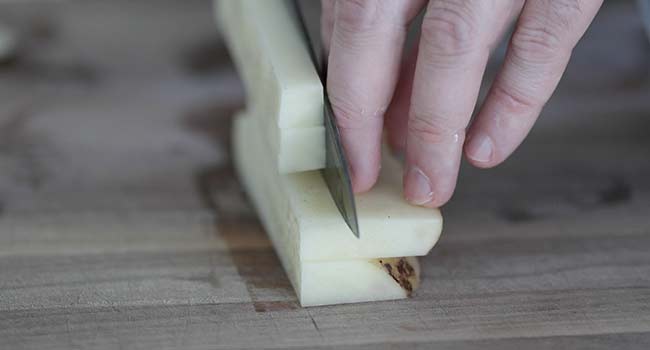 cutting potatoes into fries