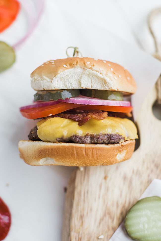 simple cheeseburger with bacon and American cheese on a sesame bun