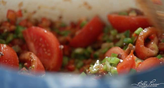 cooking tomatoes with peppers and onions