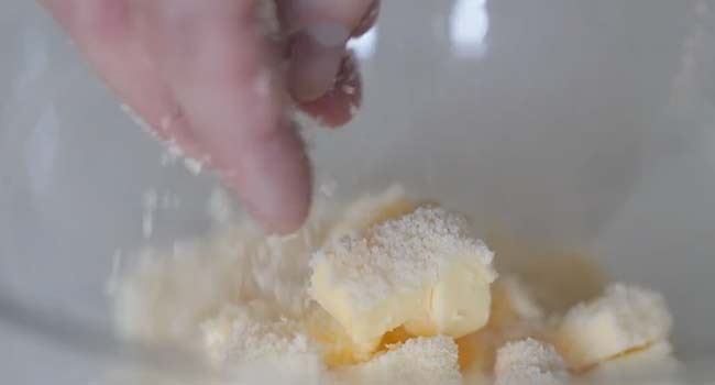 adding cheese to butter