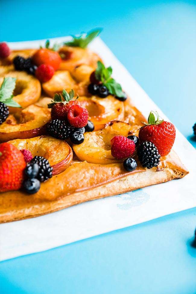 corner off puff pastry with peaches