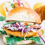 salmon burger with coleslaw and arugula