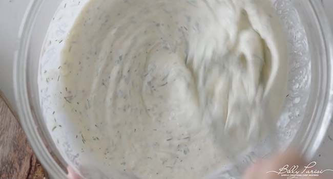 whisking together a creamy dressing