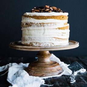 rum pumpkin layer cake with pecan, currants and a maple cream cheese frosting