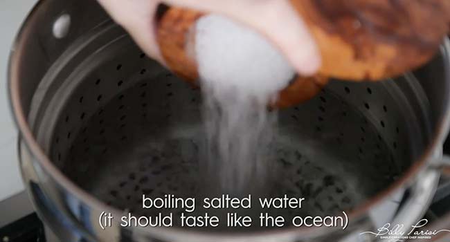 adding salt to boiling water