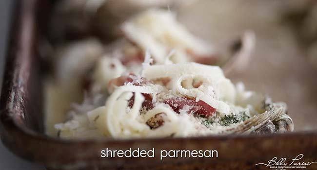 adding parmesan to oysters rockefeller