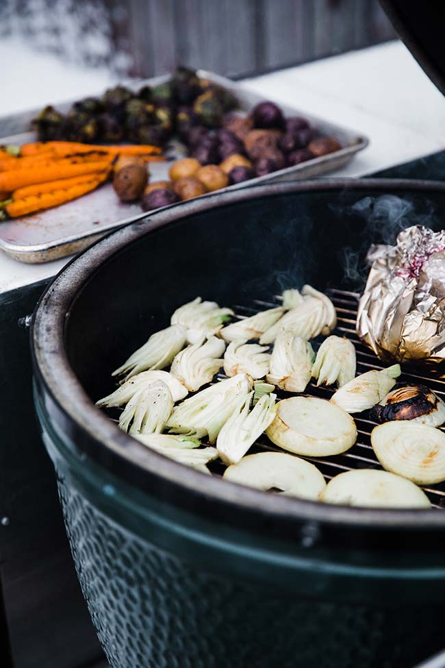 roasting vegetables on a grill for a crudite platter