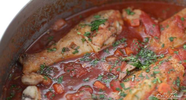 garnishing chicken cacciatore with parsley