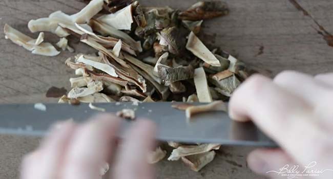 chopping porcini mushrooms