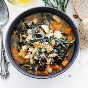 bowl of ribollita soup with kale and carrots