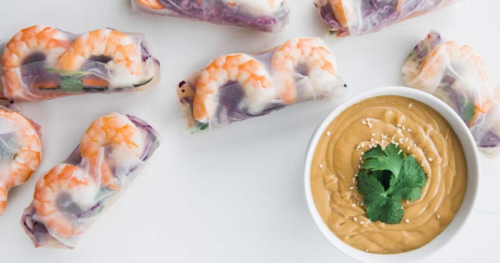 Shrimp Spring Rolls with bowl of peanut butter sauce