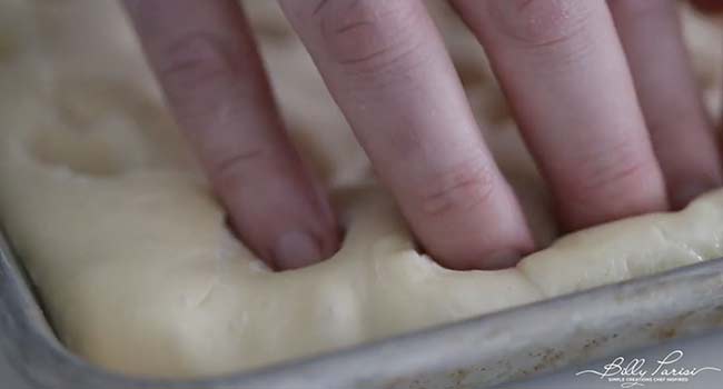 pressing in the dough