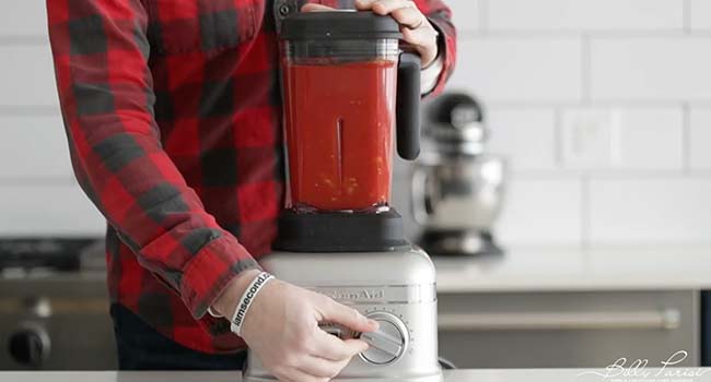 blending tomatoes in a blender