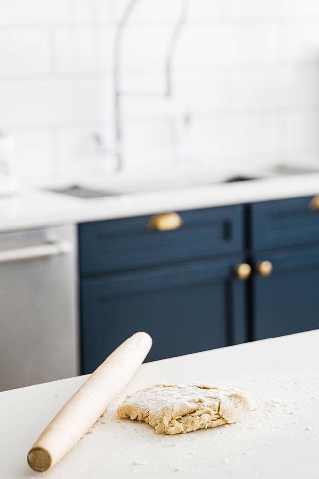 rolling out pie dough with a rolling pin