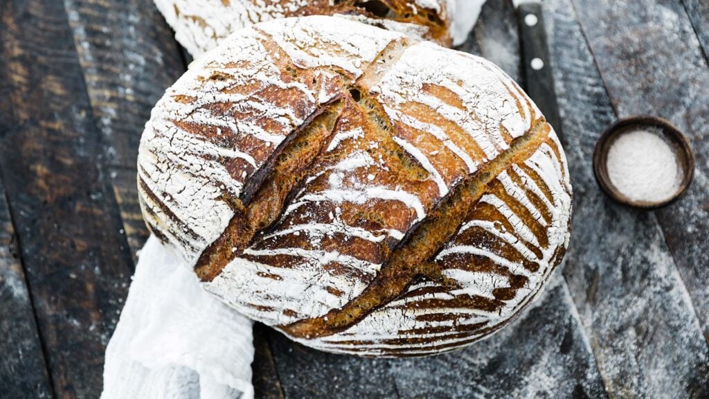top down picture of a graham wheat flour bread recipe with dusting of flour