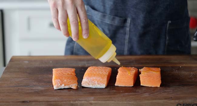 drizzling salmon with oil