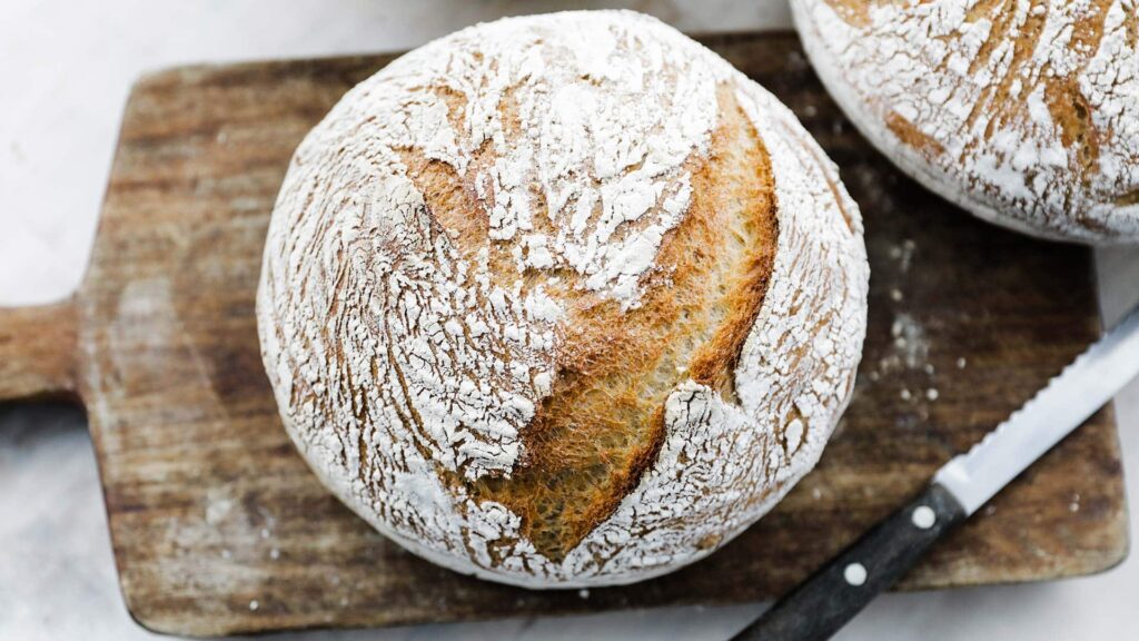 kamut flour bread recipe on a cutting board with a knife