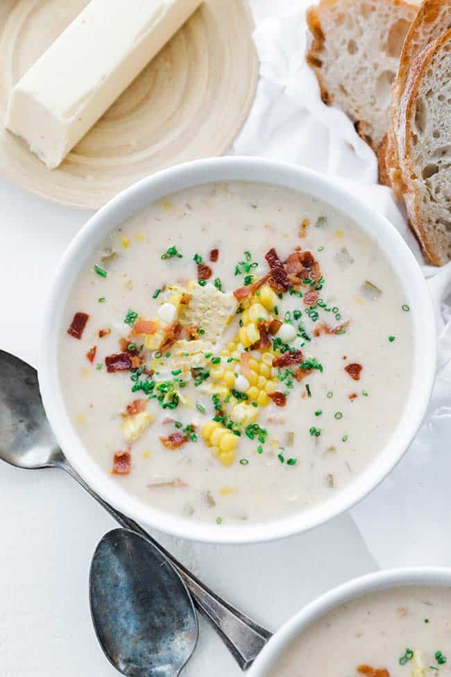 corn chowder served with sliced bread