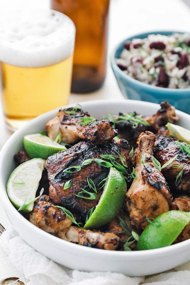 grilled jerk chicken with a beer and rice and beans