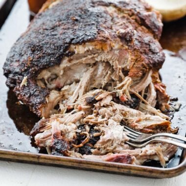 Pulled smoked pork shoulder on a sheet tray