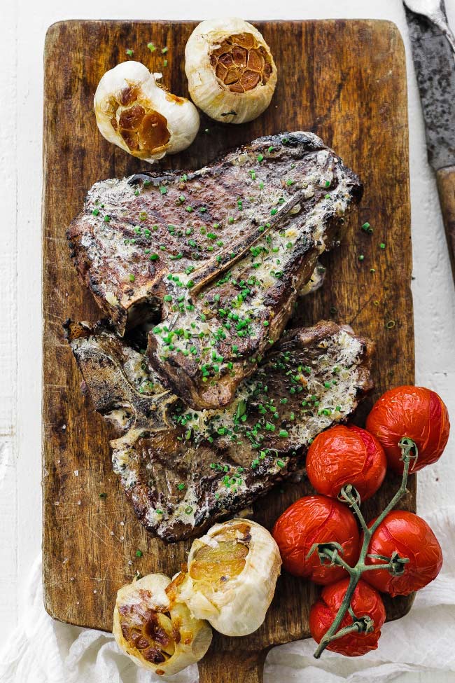 t bone steaks on a cutting board