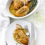 casserole dish of sliced chicken with a plate of sliced chicken