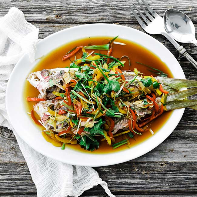 steamed whole fish with vegetables and soy sauce