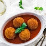 white wine served with arancini balls and pomodoro sauce