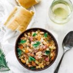 pasta and beans served with bread and wine