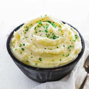 bowl of mashed potatoes with chopped chives