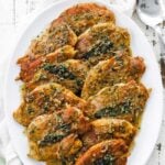 chicken saltimbocca with white wine sauce on a platter