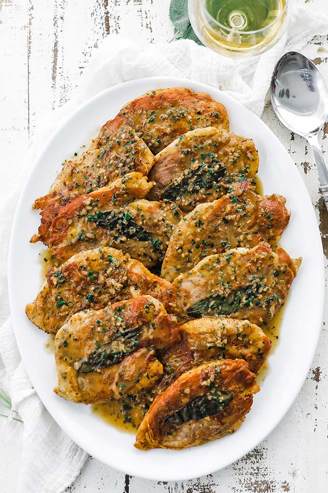 chicken saltimbocca with white wine sauce on a platter