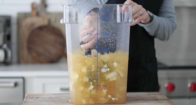 mixing together a brine in a container