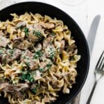 plate of mushrooms, beef and onions in a stroganoff sauce