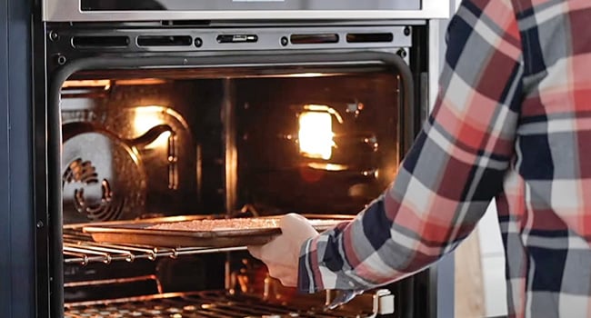 adding salmon to the oven