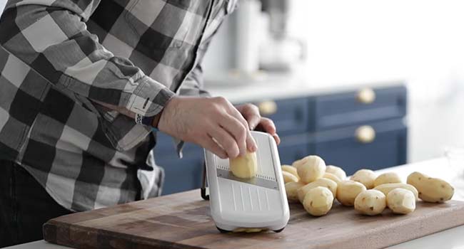 slicing potatoes