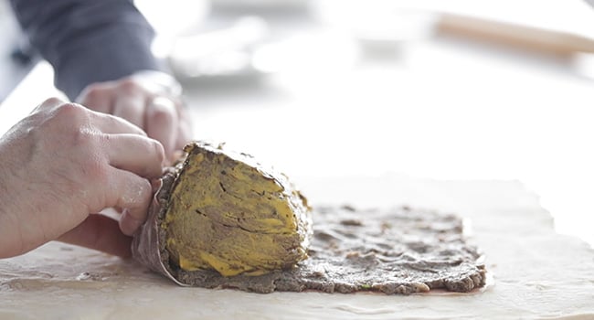 rolling up beef wellington