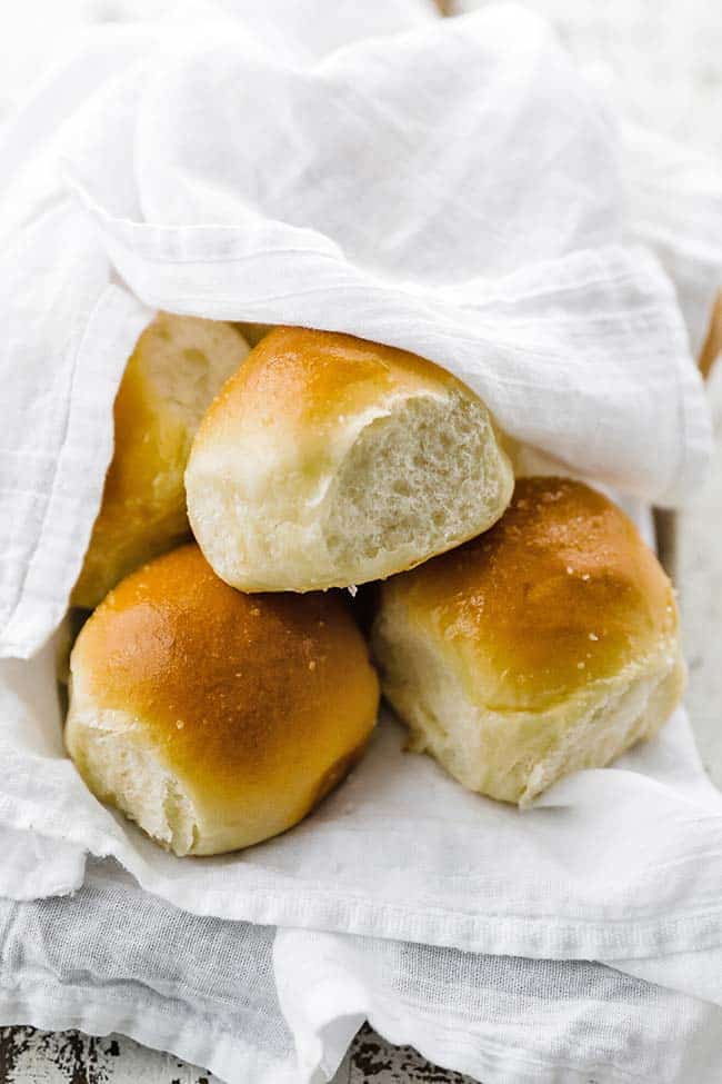 a towel filled with cooked dinner rools