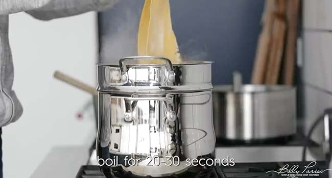 adding pasta to a boiling water