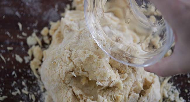 adding water to dough