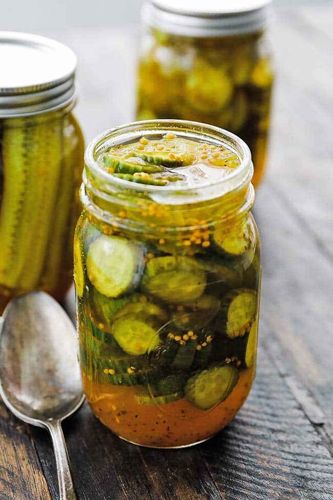 homemade bread and butter pickles in a 16 ounce glass mason jar