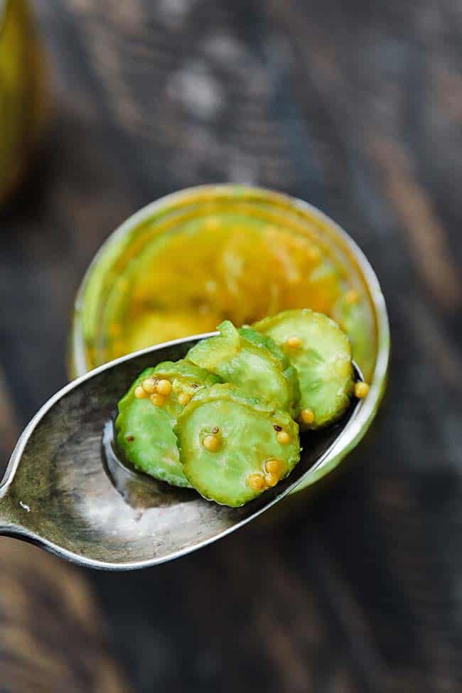 a spoon full of bread and butter pickle chips