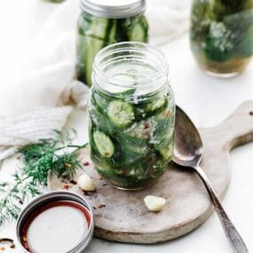 dill pickle slices in a jar with garlic